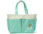 Jasnozielona tkanina Eleganckie, stylowe torby na przewijanie dla niemowląt Haftowane logo z przodu